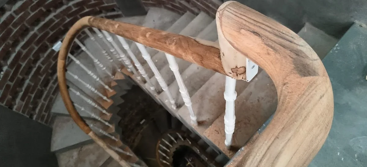 Renovated curved timber staircase and handrail