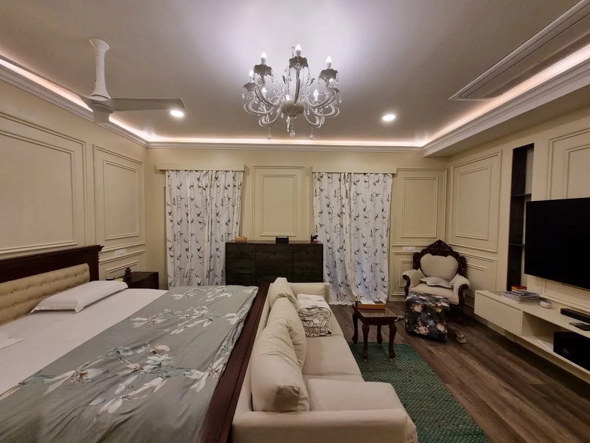 Completed master bedroom with paneled walls and coordinated furnishings